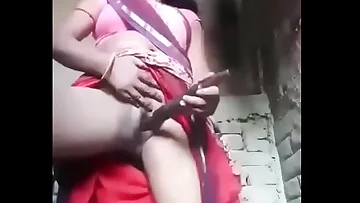 Puri is tucking the bandage into her pussy.